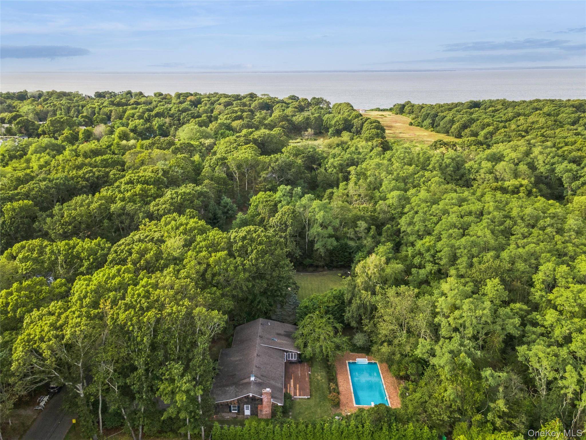 East Marion, North Fork Soundcrest Woods Ranch with 20x40 Pool, Steps from the Beach amp ; Low Taxes.