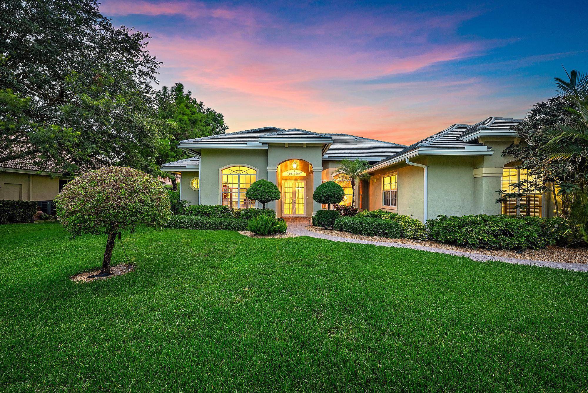 EXQUISITE, CBS five bedroom, three bathroom pool home in one of Jupiter's best kept secrets a serene, low HOA community offering the added financial benefit of Martin County taxes.