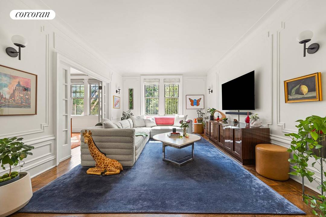 Welcome to 125 Prospect Park West a truly special home with full views of Prospect Park and a sprawling layout featuring three bedrooms, two newly renovated bathrooms, a formal living ...