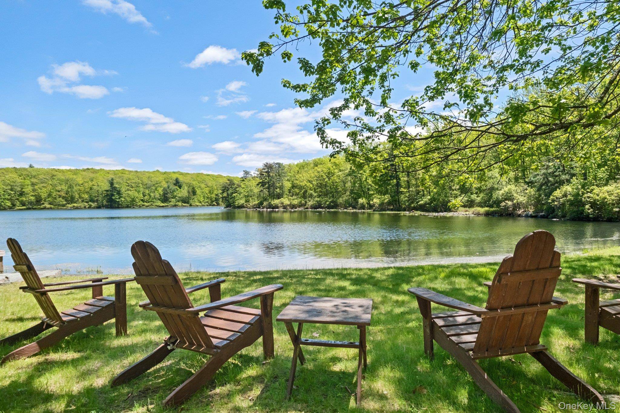 Located in the highly sought after community of Wolf Lake, this expansive lakefront property offers a rare blend of privacy, space, and water access set on almost one acre across ...