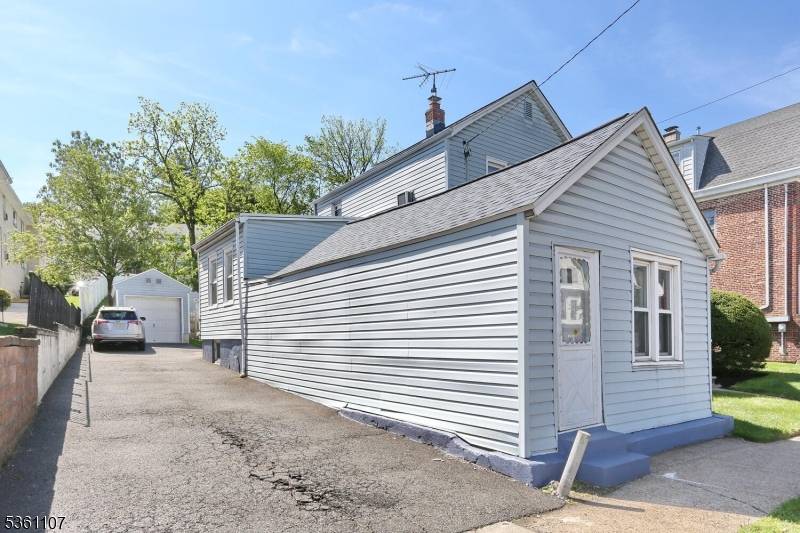 Cozy well maintained 3 bedroom 2 bath home with wrap around front porch on 80 foot wide property.