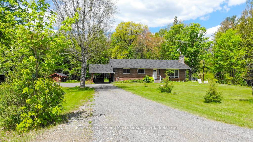 Nestled on nearly 5 private acres surrounded by mature trees, this charming 3 bedroom, 1 bath brick bungalow offers peace and privacy in Magnetawan.