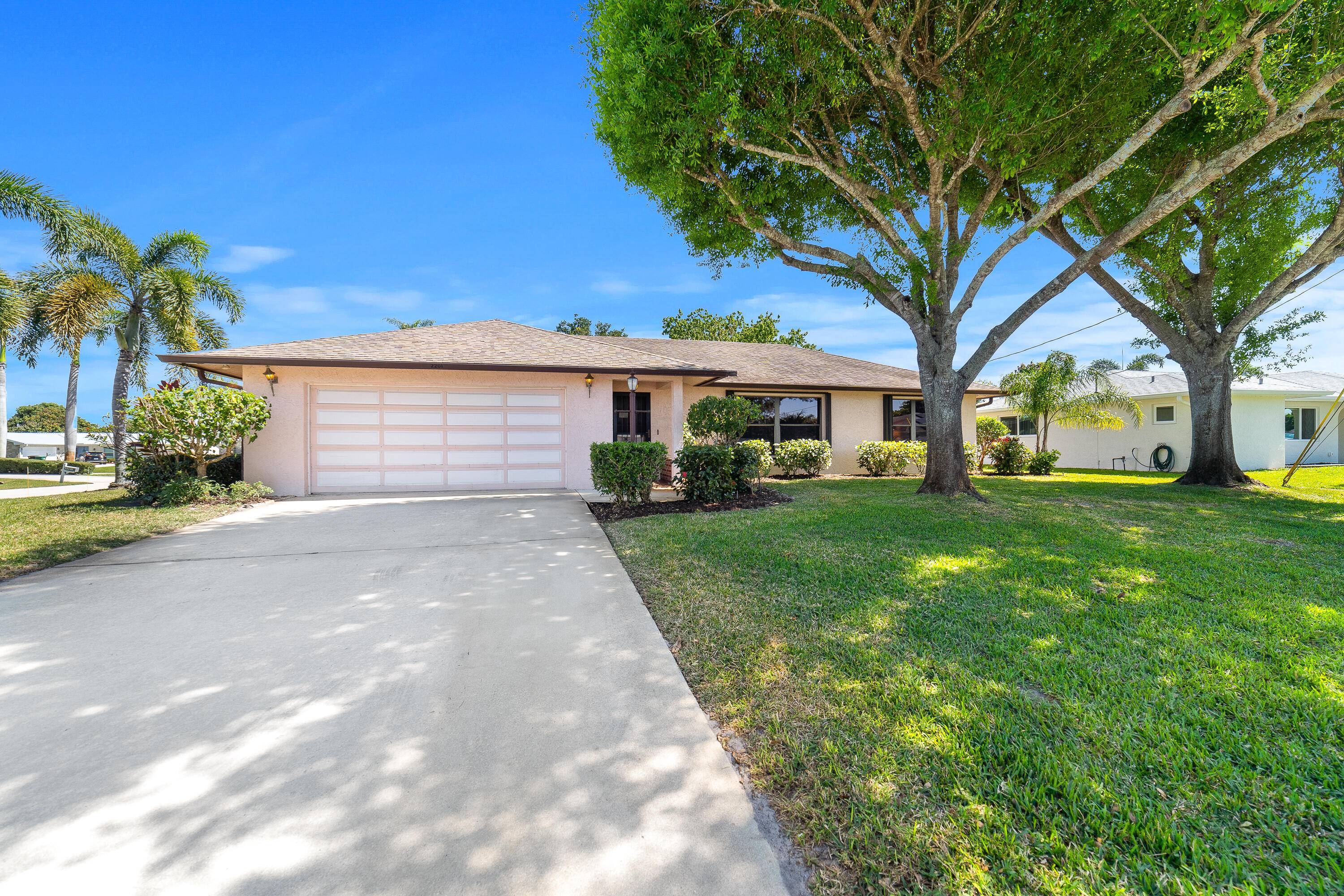Discover the charm of this 1982 CBS home, nestled on a spacious corner lot in Port St.