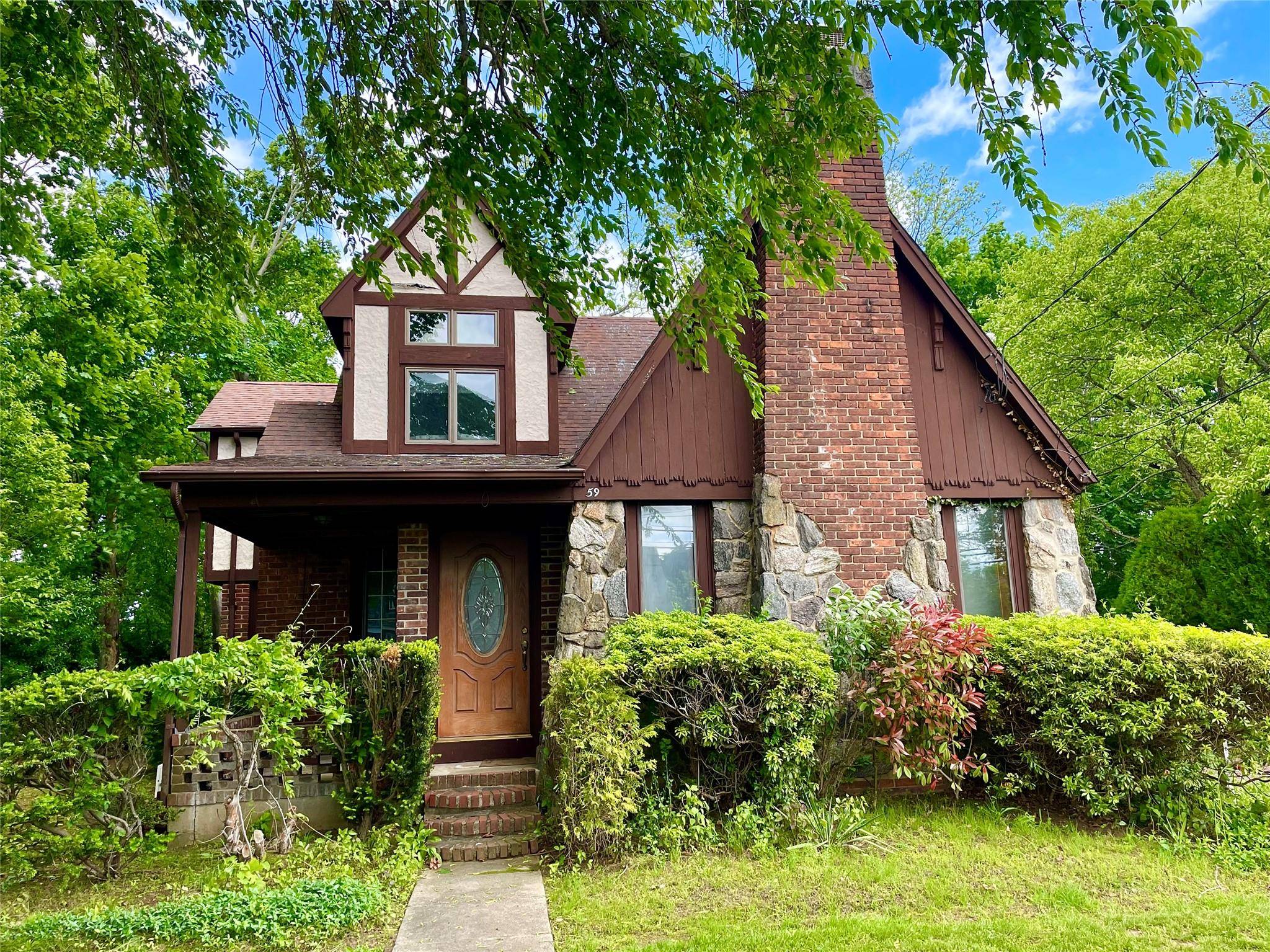 Grand Tudor home located in lovely Bay Shore community.