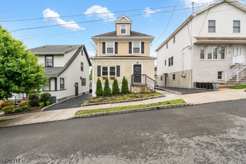 Welcome to 38 Hazel Ave, a classic Colonial that blends charm, flexibility, and everyday convenience.