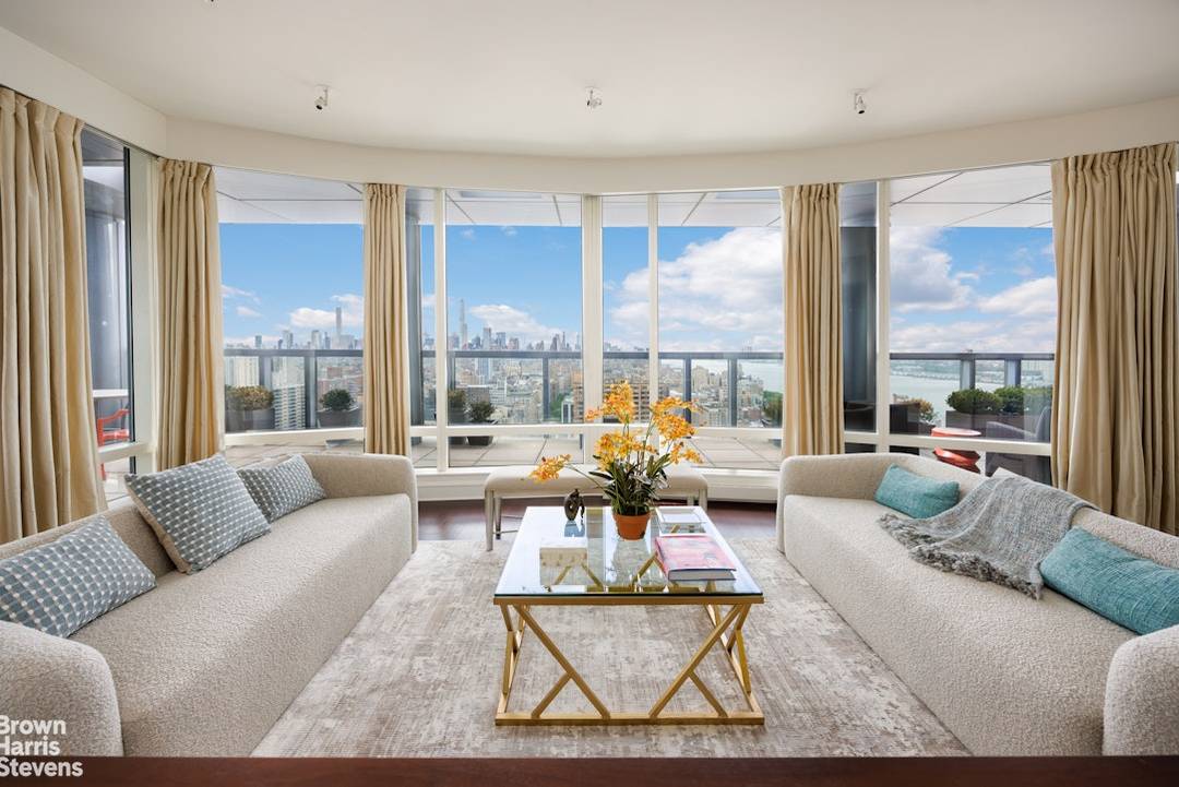 Perched atop the coveted Ariel East, this extraordinary approximately 5, 000 square foot, 5 bedroom plus a den, 6.