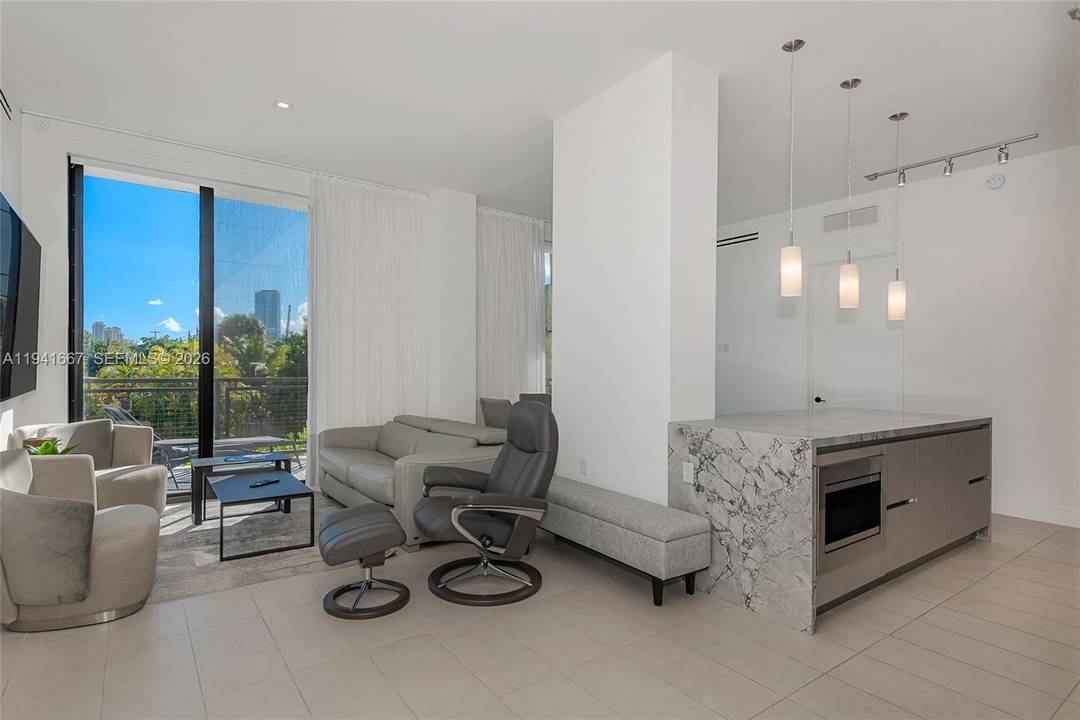 Modern South Beach living in one of the area s few newer buildings priced under 900 SF.