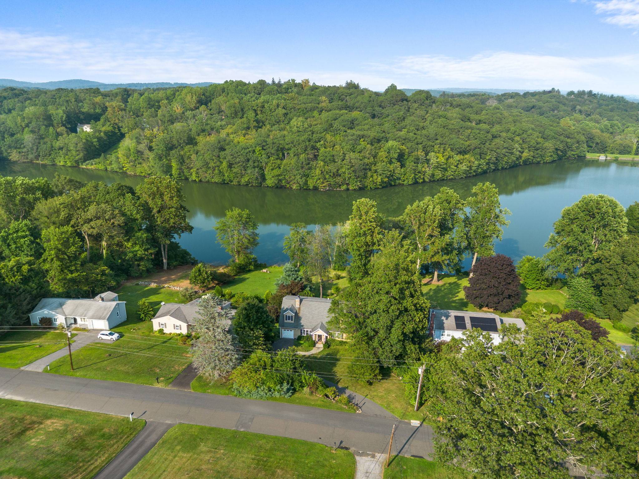Discover beauty and convenience with this unique 4 bed, 4 full bath home with nearly 3, 500 square feet on Upper Kohanza Lake in Danbury's west side.
