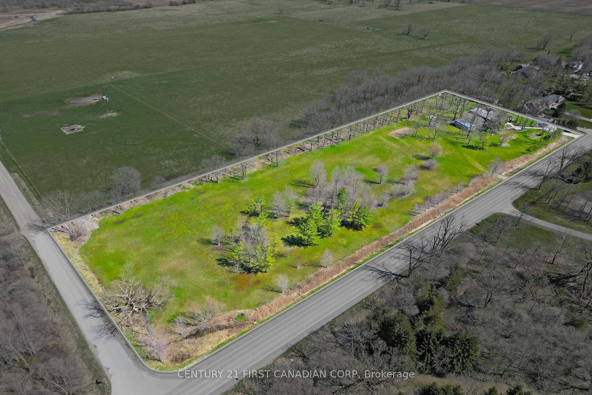 Beautiful 5. 8 Acres corner lot with a 3, 071 SQFT bungalow, 883 feet of frontage and 285 feet deep with a 20x40 workshop.