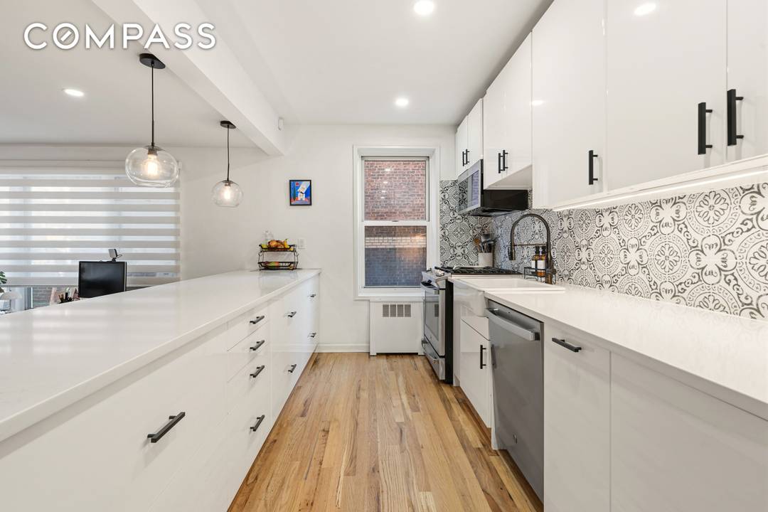 Fully Renovated 2nd floor corner residence with private terrace, skyline garden views, and optional garage parking, located at Terrace View in the Jackson Heights Historic District.