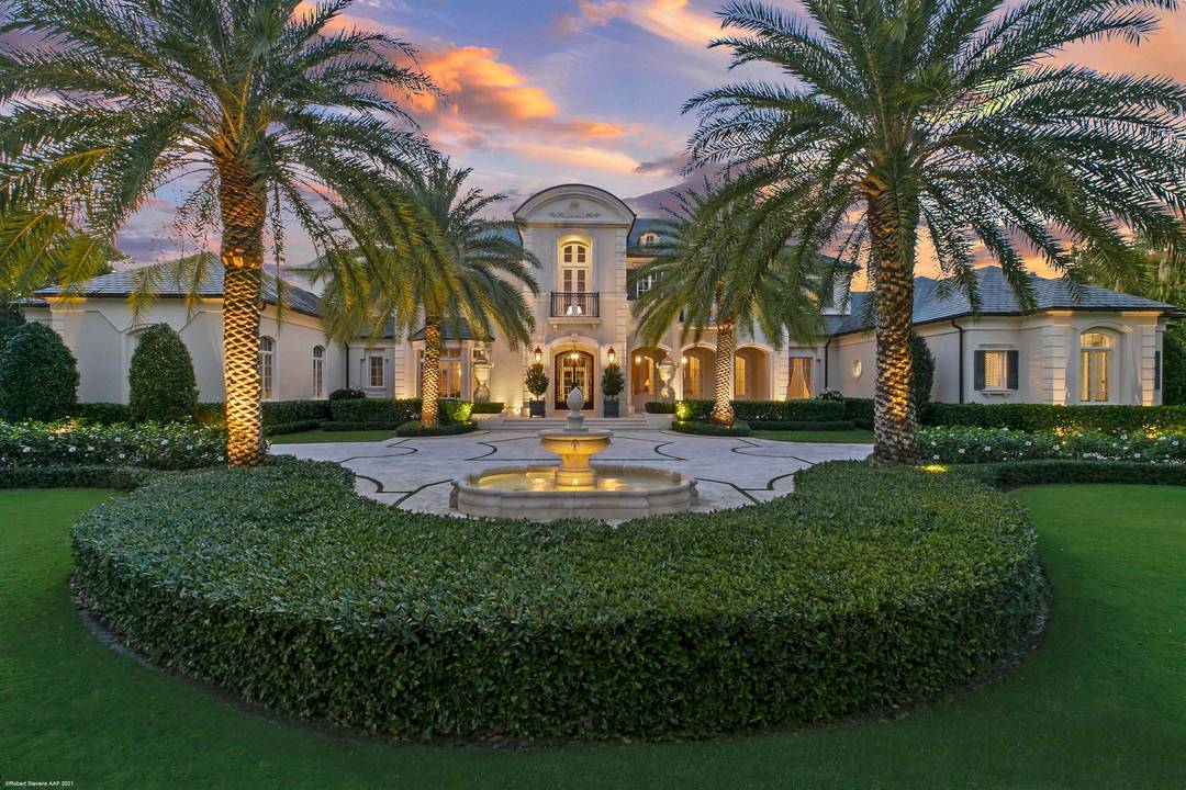 This timeless European Estate Home sits on 1.