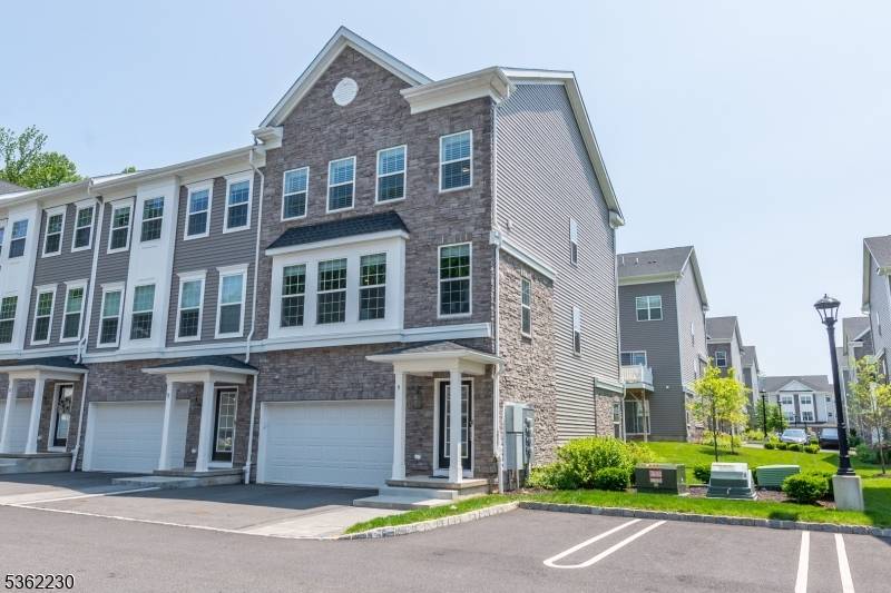 Stunning End Unit Townhome with Designer Upgrades Smart Home Features !