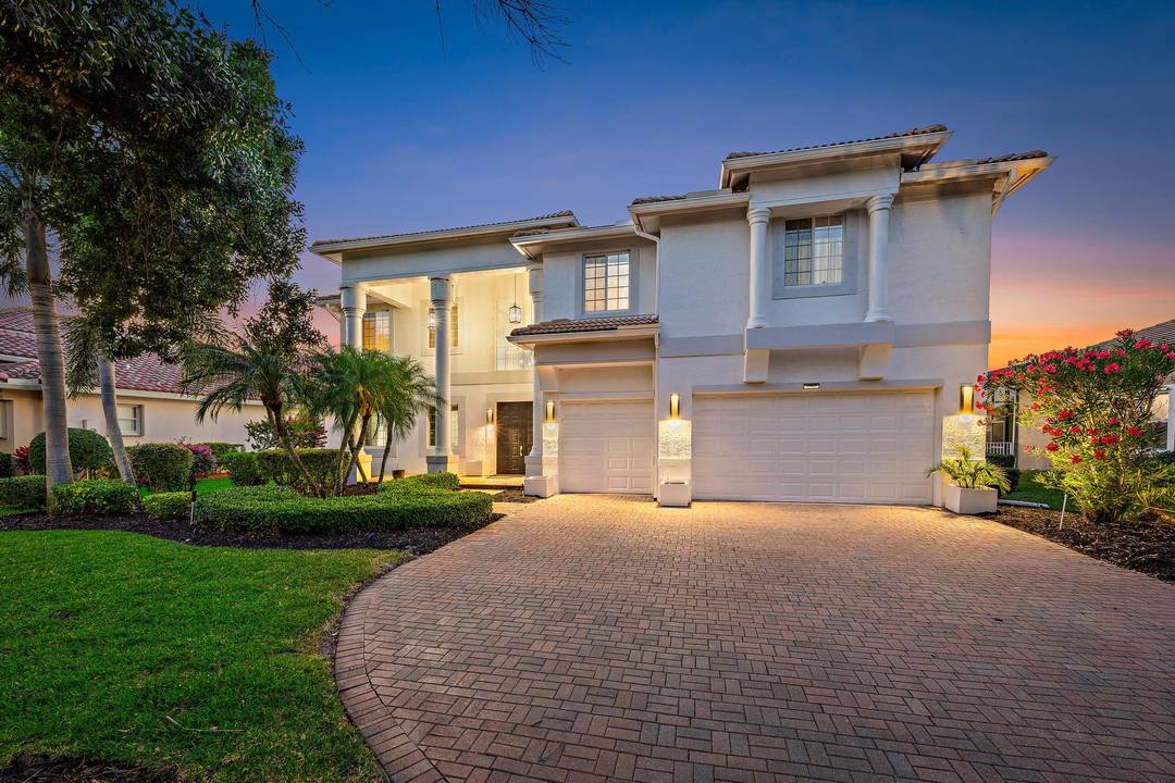 EXQUISITE lakefront CBS six bedroom, four bath estate home located in the prestigious gated community of The Estates of Hammock Creek in Palm City.