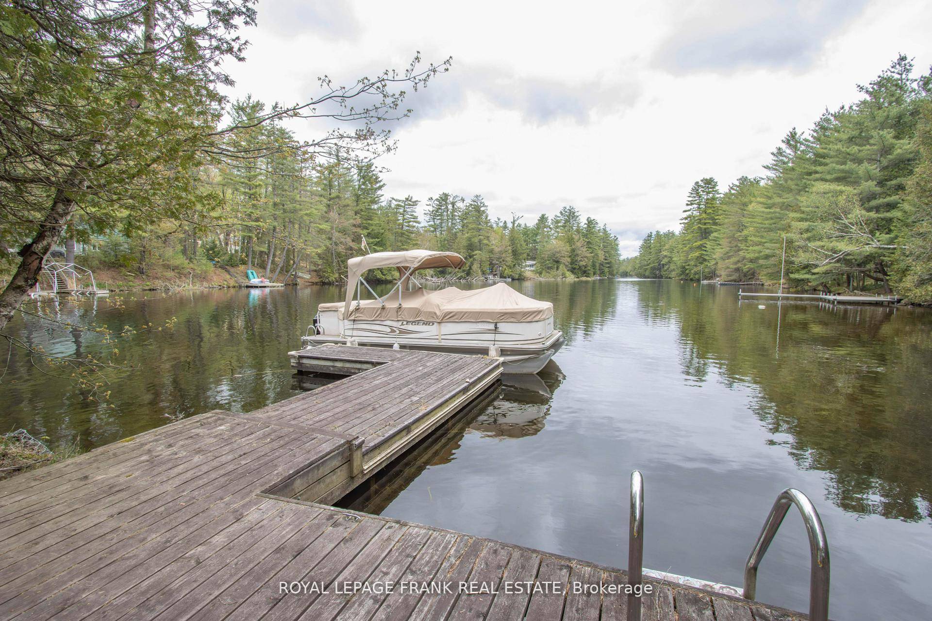 Welcome to this rare and beautiful riverfront retreat, perfectly nestled in nature's embrace along the tranquil Gull River.
