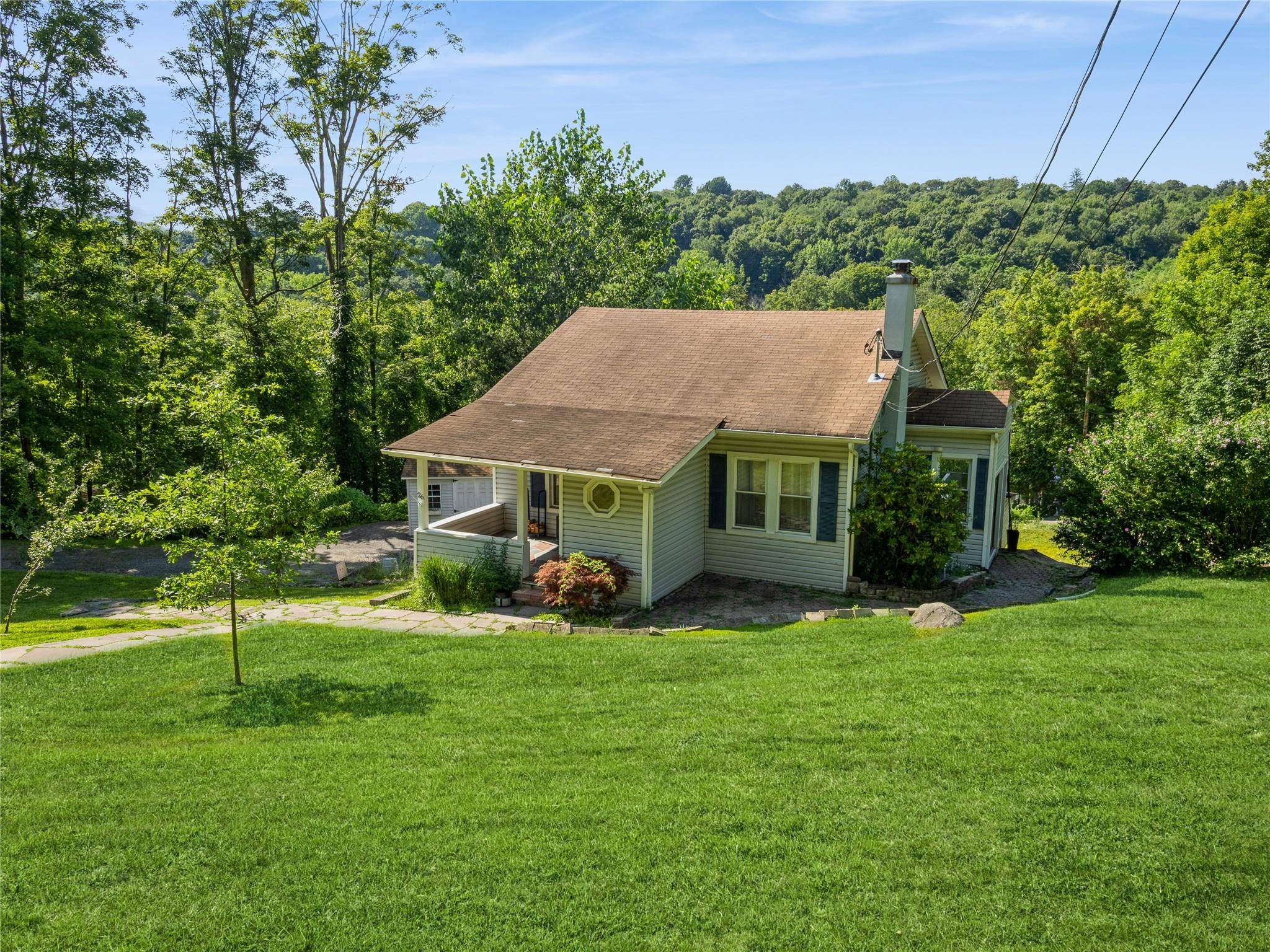 Fall in love with this newly renovated and modernized cottage on nearly 1 acre of private property.