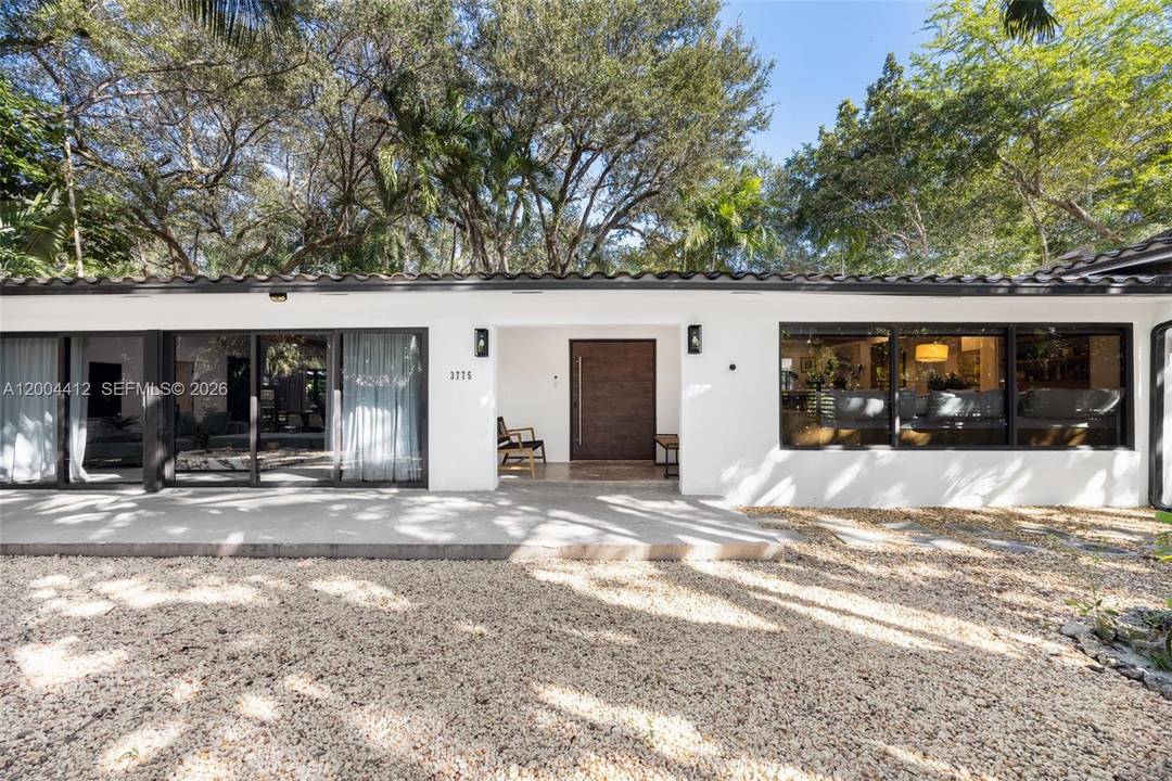 Discover the pinnacle of Tropical Modernism in this South Coconut Grove home, completely reimagined in 2024.