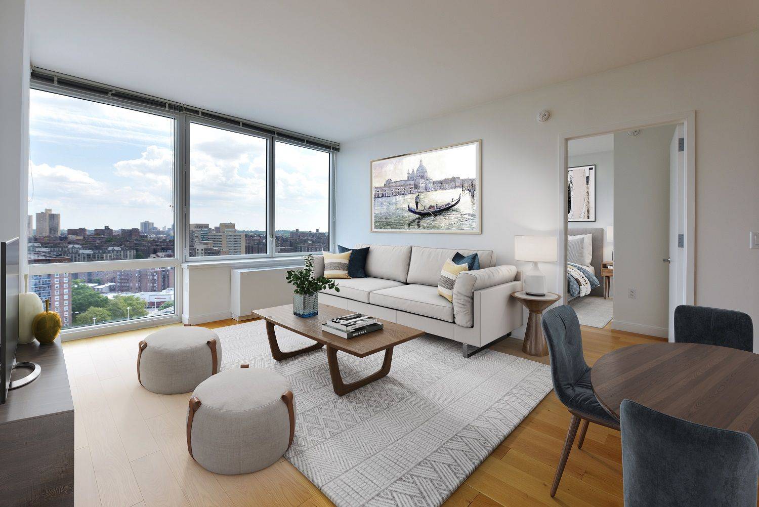 Bright 1 bedroom with corner living room windows, a gourmet kitchen featuring stainless steel appliances Caesarstone quartz countertops, and eating bar and an in unit washer dryer.