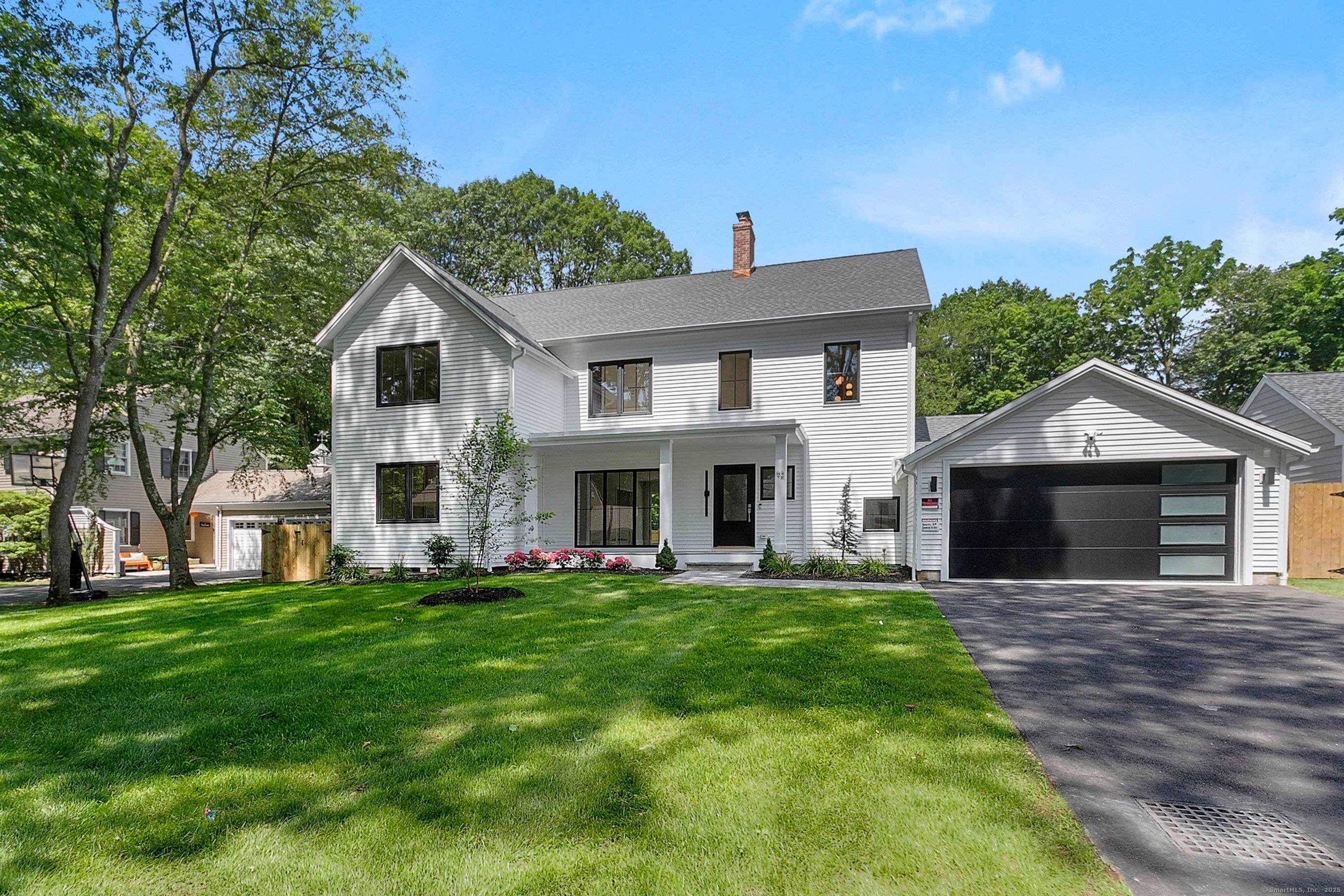 Gorgeous new construction on a private tree lined cul de sac.