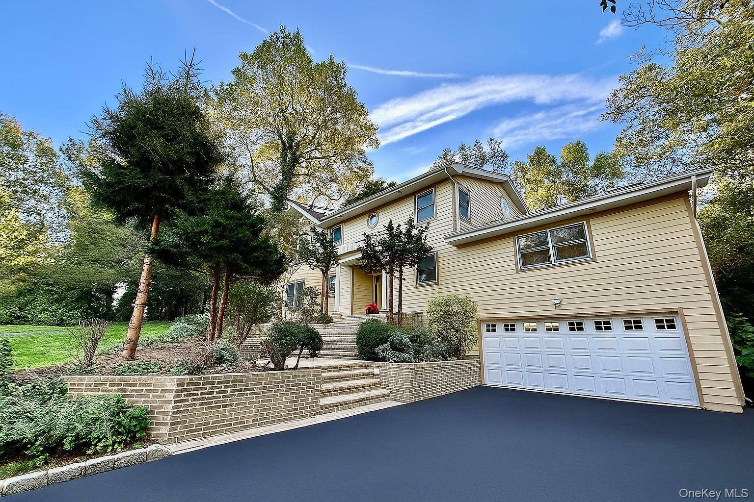 WELCOME TO 8 BRIARFIELD DRIVE LAKE SUCCESS SPRAWLING COLONIAL HOME TOTALLY RENOVATED 2004 ON A QUIET PICTURESQUE LOCATION !