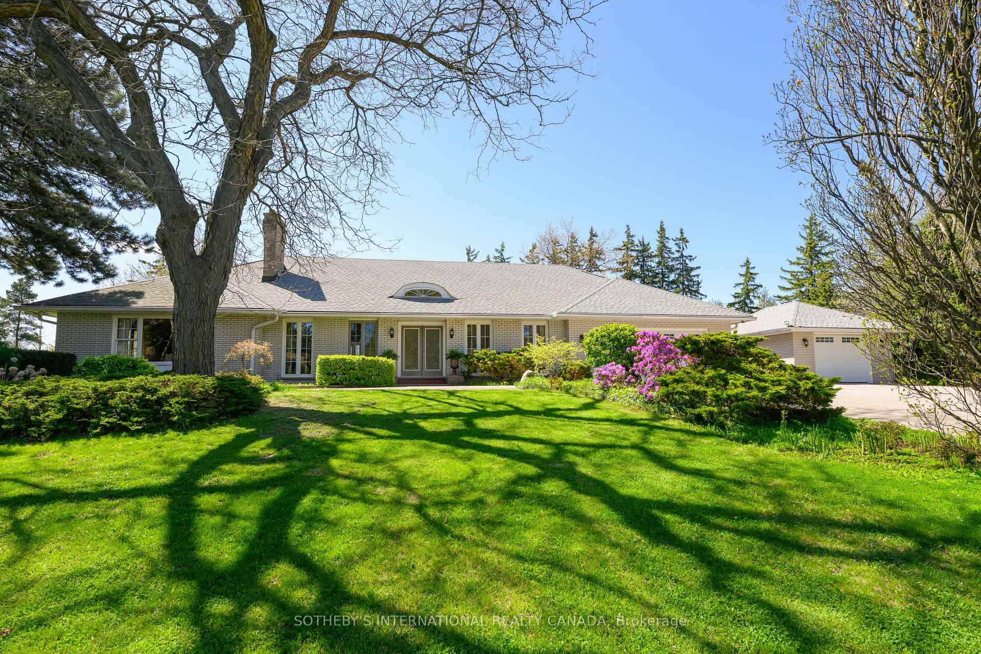 Follow the winding 400 foot paved driveway and discover a world of privacy, elegance, and serenity all just minutes from the city.