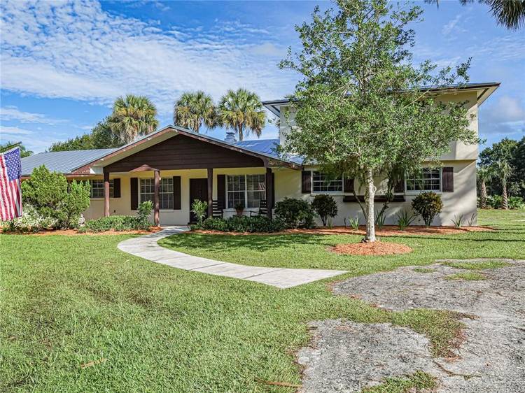 Welcome home to this serene country retreat on acreage !