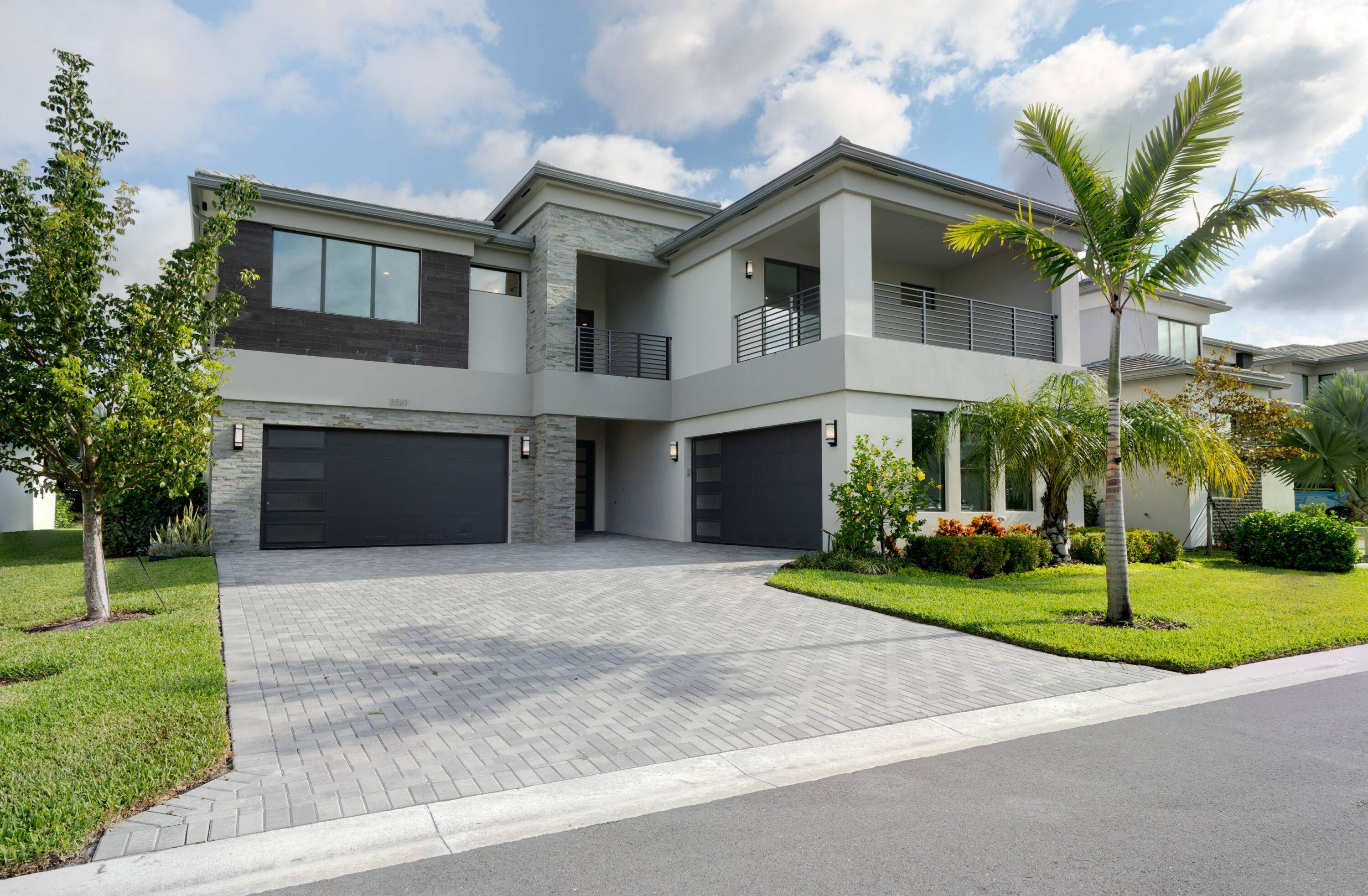 This new two story contemporary gem at Lotus Palm, Boca Raton, delivers an elevated resort lifestyle.