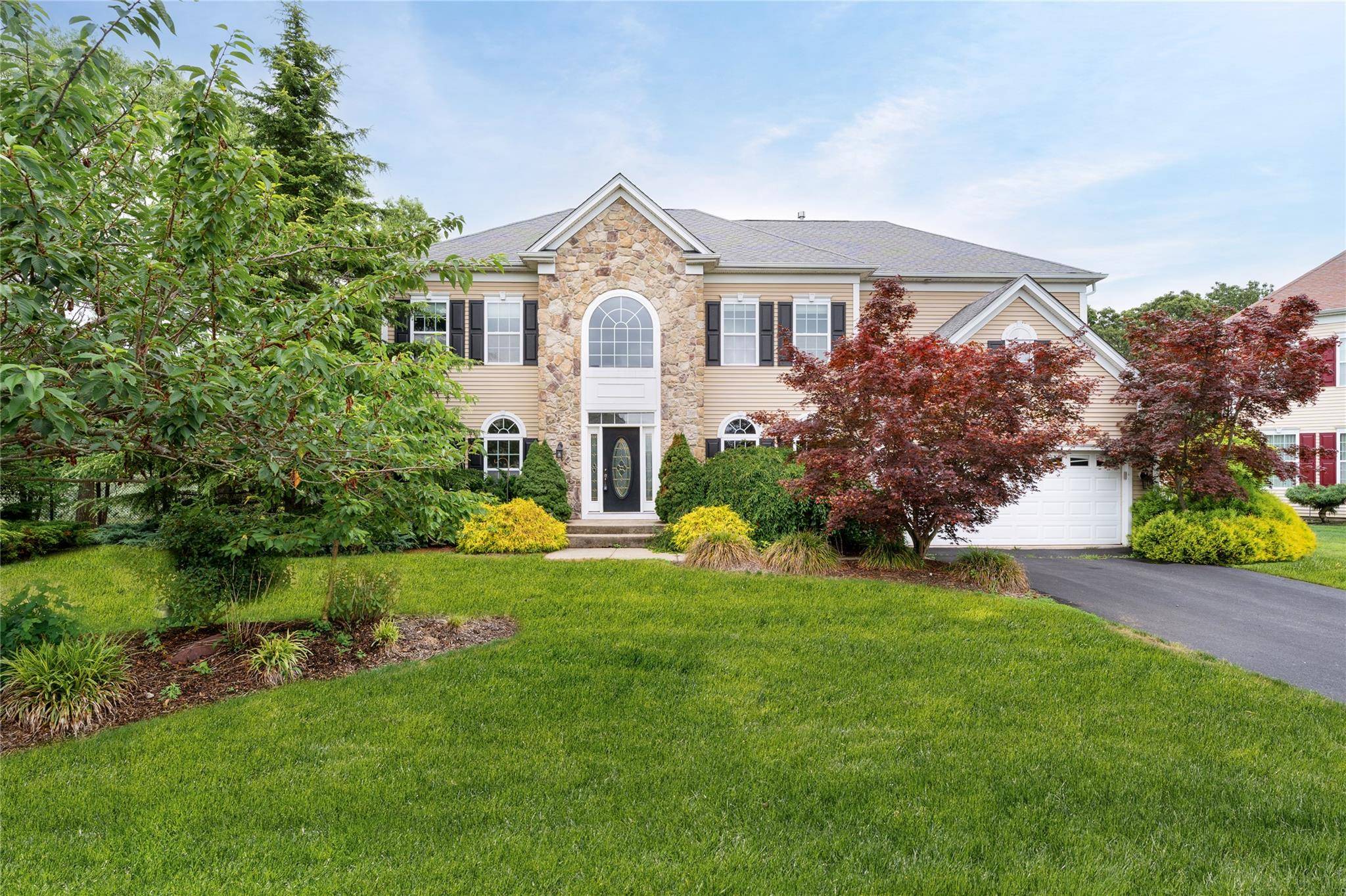 This DIAMOND 5 Bedroom 4 1 2 Bath Post Modern Home in the gated community of The Villages at Mount Sinai in the desirable Mount Sinai School District.