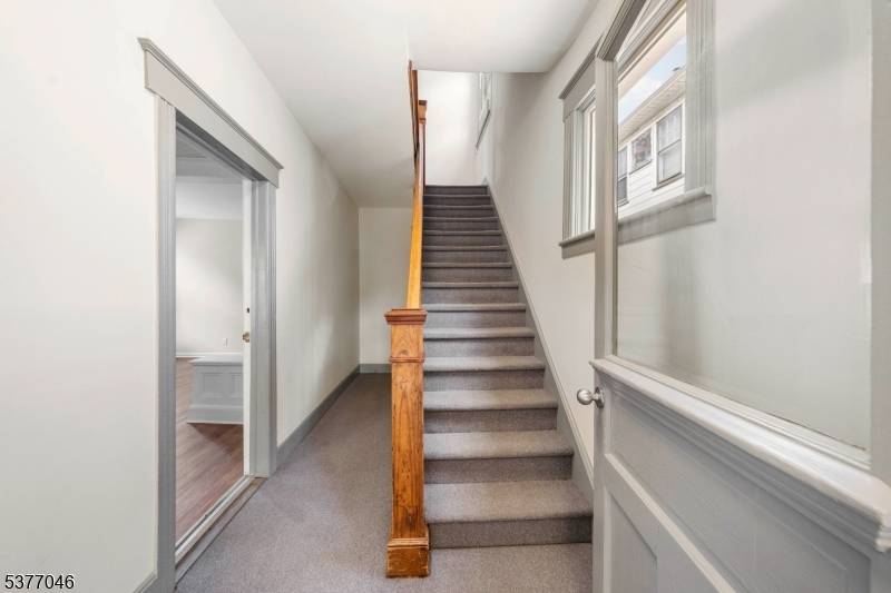 Once a legal 3 family home, this beautifully transformed property is now an expansive 2 family residence offering three full floors of thoughtfully renovated living space.