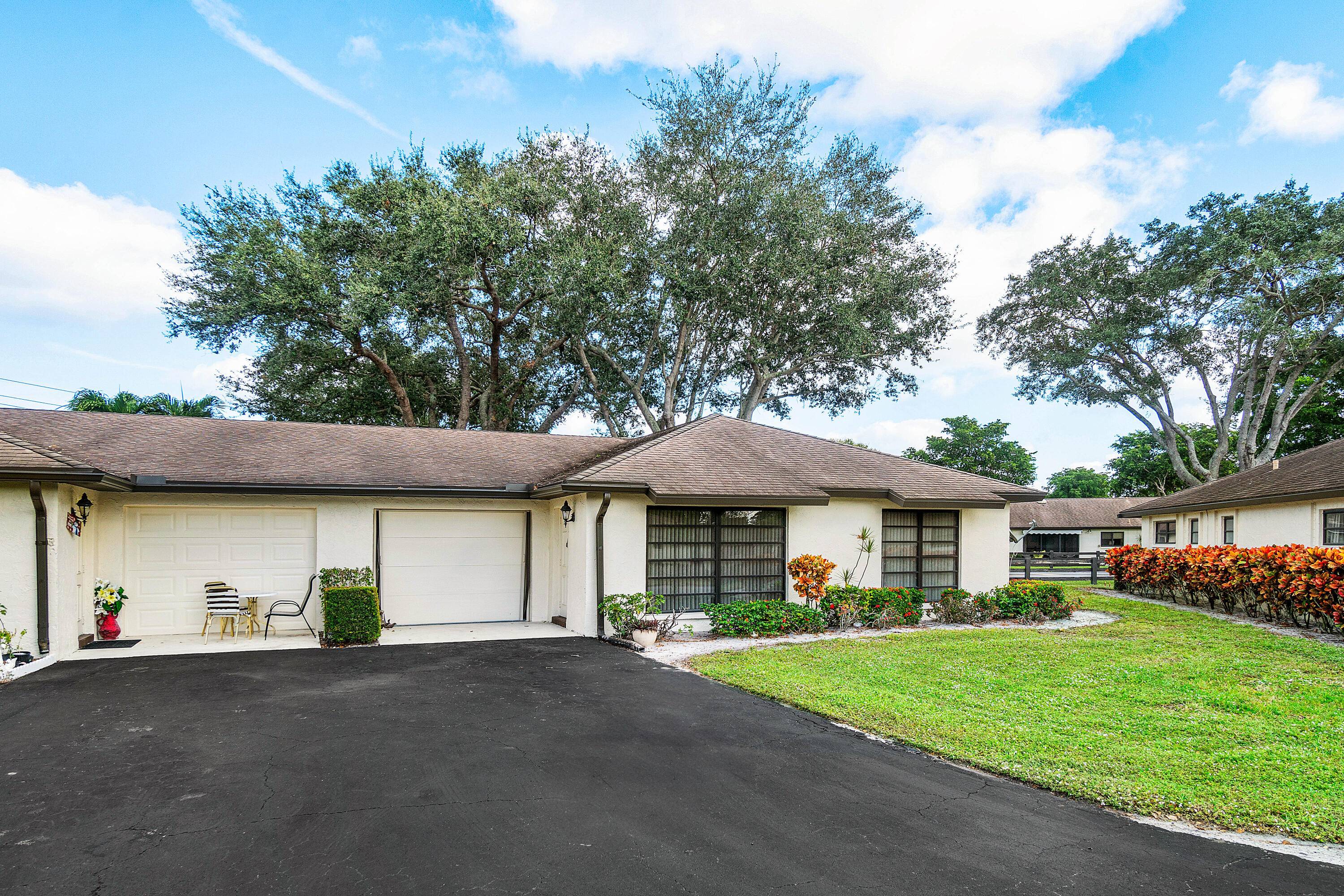 A LONG 2 CAR DRIVEWAY RARE find in Greentree Villas !