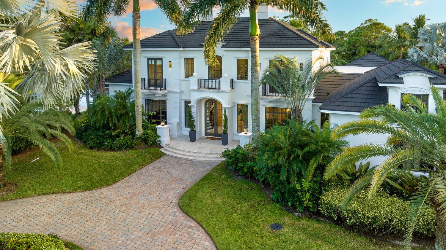 Enjoy the true essence of Florida Living in this exclusive, custom grand estate in the highly sought after gated community of Hidden Bridge.