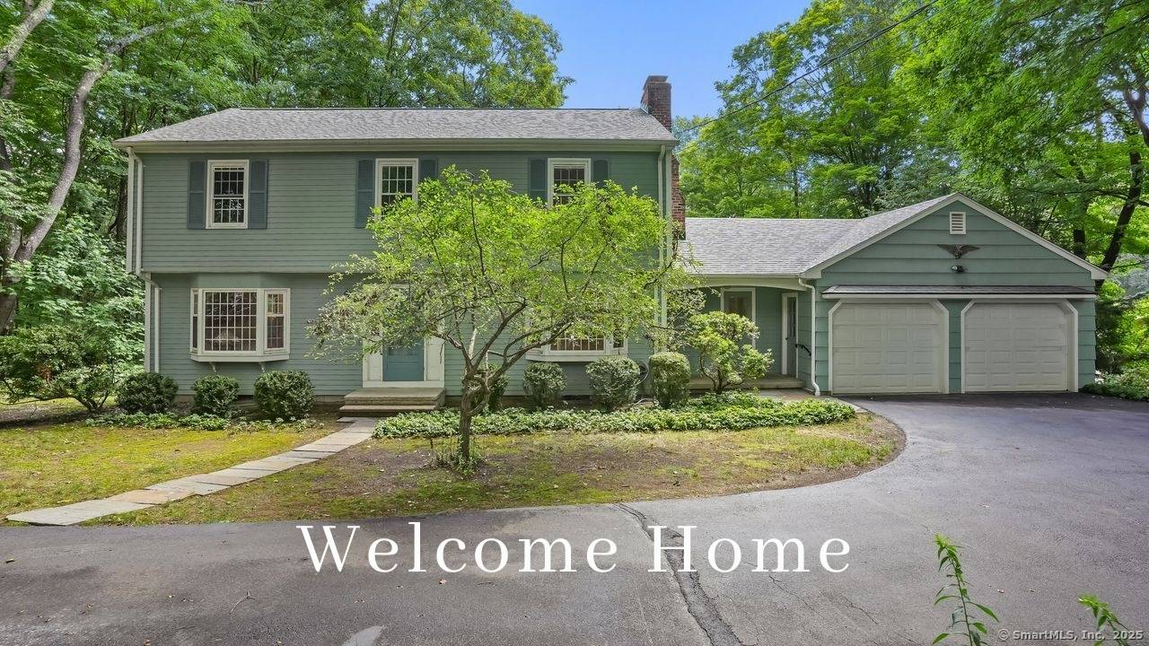 Set back from the road and surrounded by nature, this beautifully updated 4 bedroom, 3.