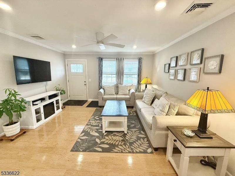 This charming ranch style home, fully renovated in 2022, offers a cozy yet spacious living environment.
