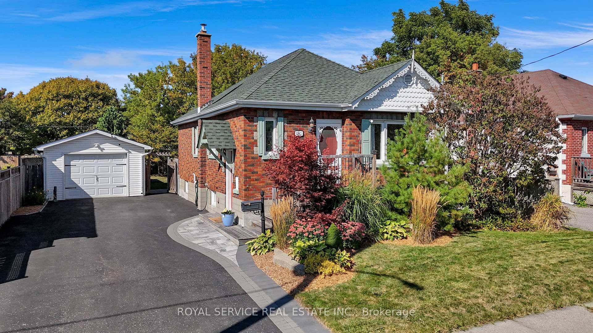 Super solid bungalow on a quiet, private street, featuring a spacious detached garage and private lot.