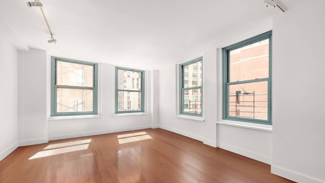 Available JULY 15. 1400 sq ft loft like 3 bedroom 2 bath features 9 ft ceilings, oversized windows, home office, great light, stainless steel appliances on kitchen.