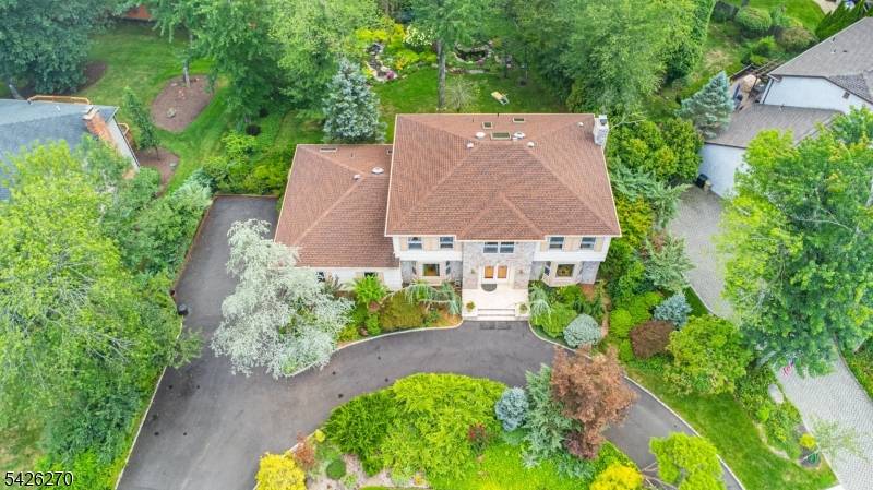 Welcome to this stunning Colonial located in a highly desirable neighborhood set on a beautifully professionally landscaped lot, this home boasts a tranquil oasis in the backyard, featuring a serene ...
