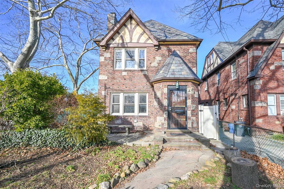 Just arrived ! Fully brick detached 3 4 bedroom Tudor situated on a desirable corner property in the prime Auburndale section of Flushing.