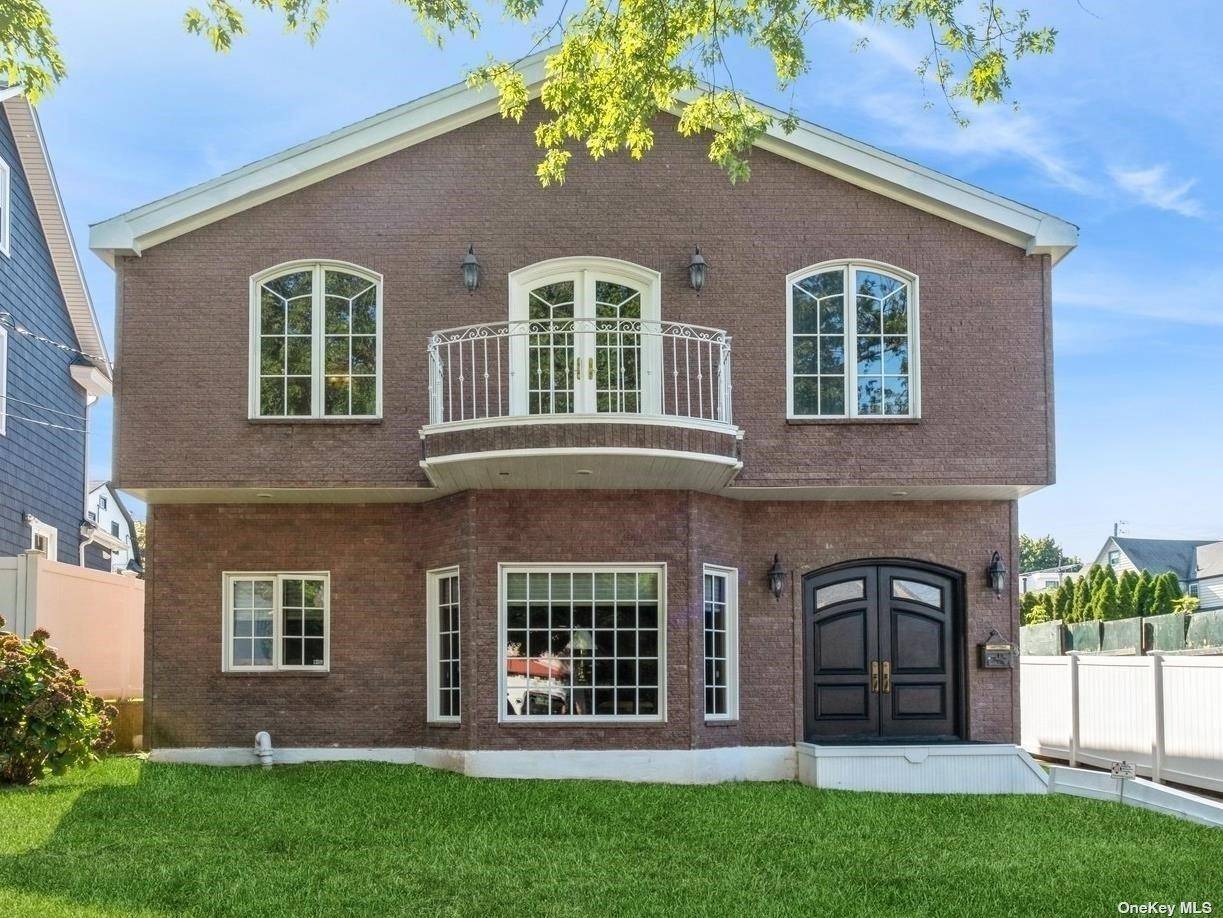 Stunning All Brick Colonial, Few Blocks from the Bay, Located on a Quiet Street in the Bayside Estates Section.