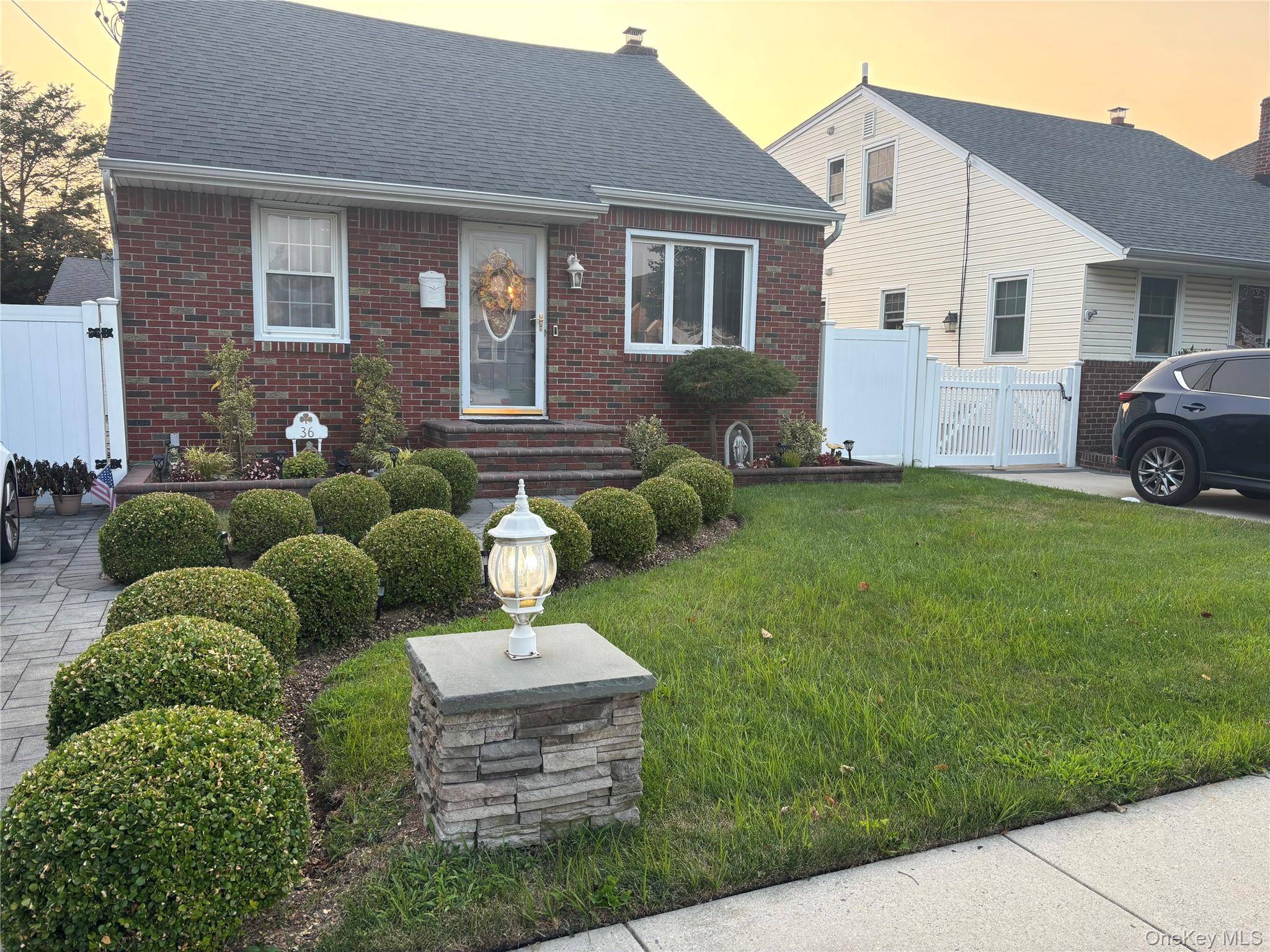 This beautiful five bedroom, two bathroom, dormered brick Cape Cod features a cozy living room with a fireplace, a dining room, and a spacious eat in kitchen with granite countertops.