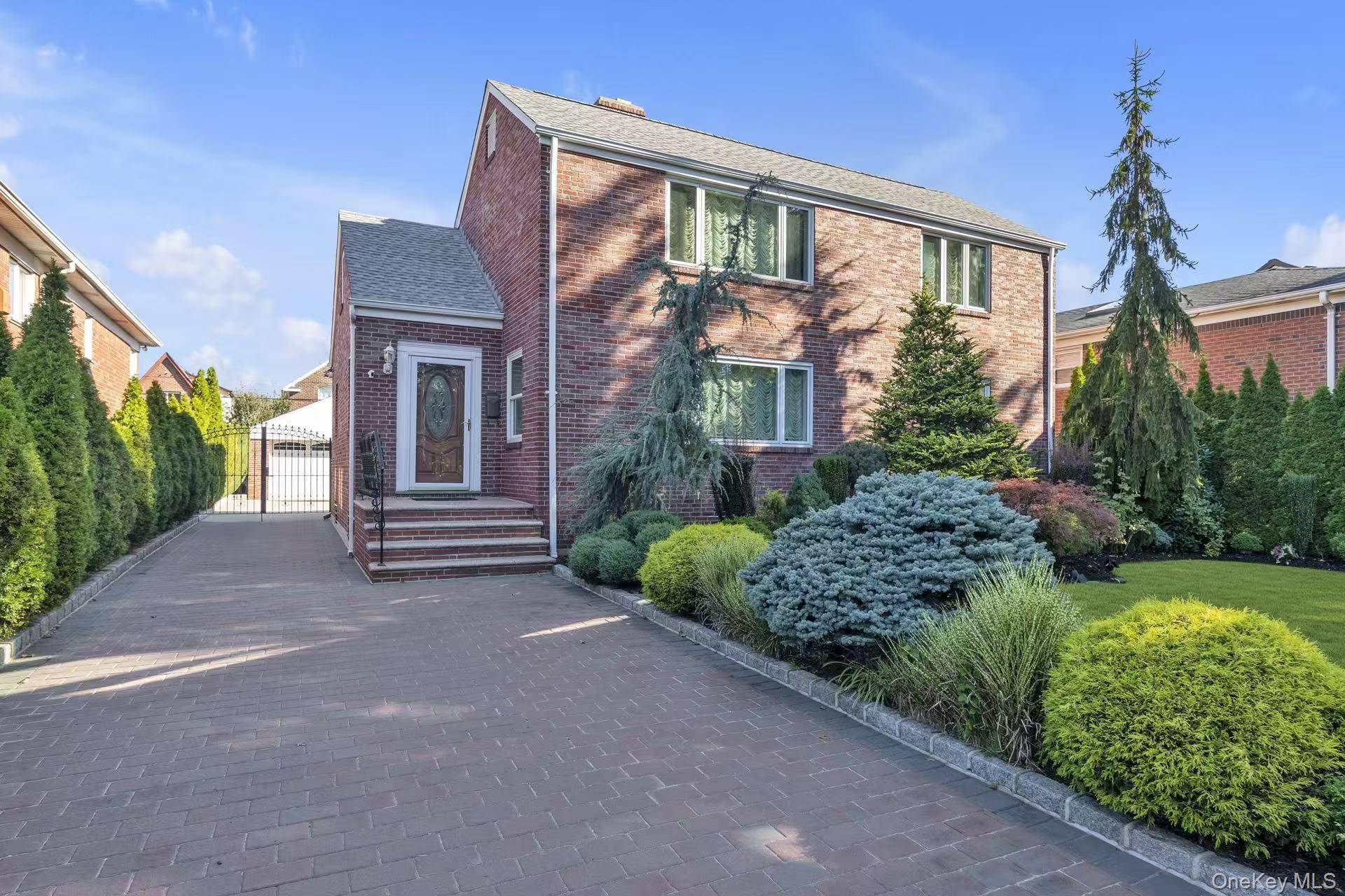 Beautiful brick 5 bedroom colonial on a large 60' x 121' lot with in ground pool, 2 car detached garage, finished basement and more.