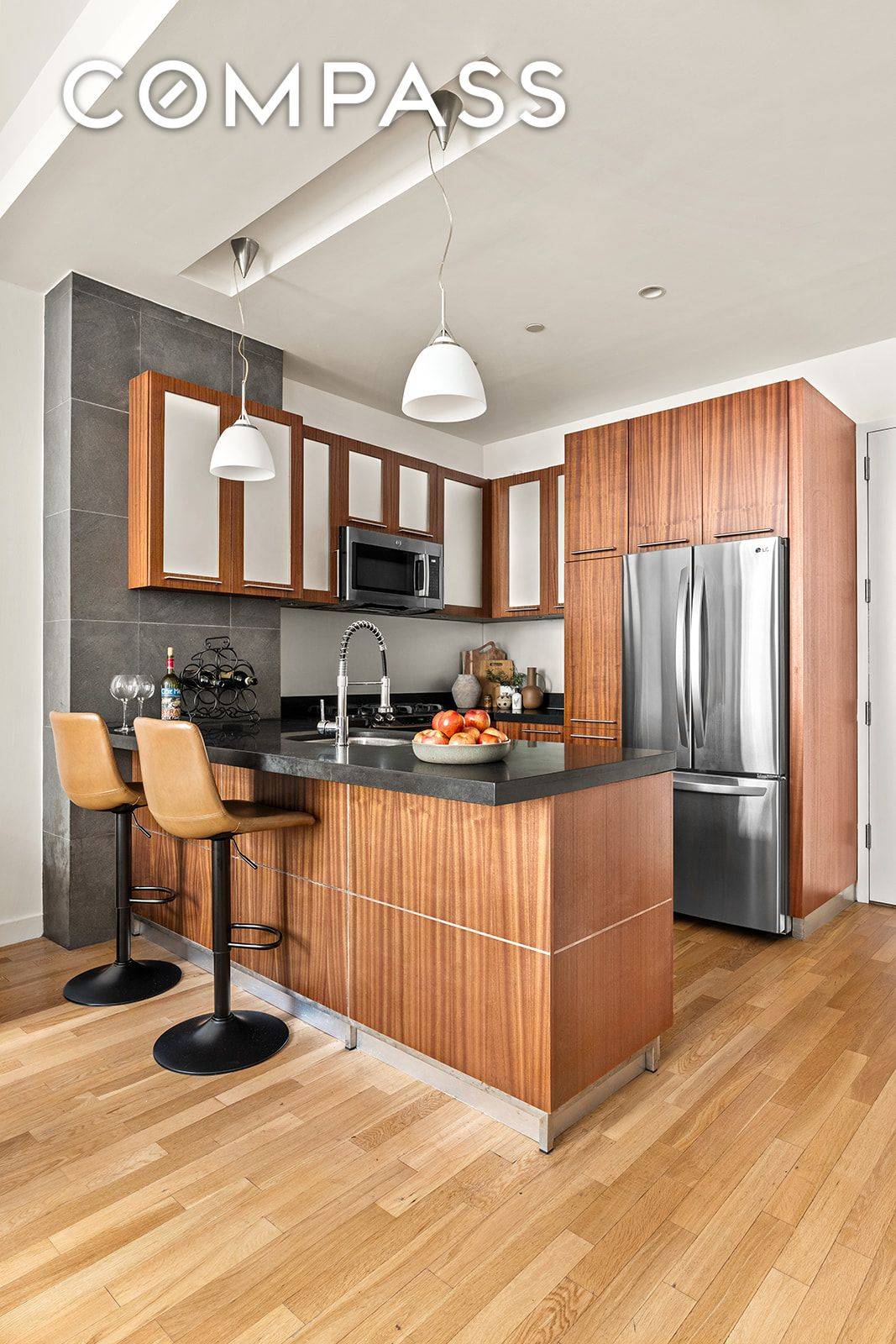 Spacious Alcove Studio with In Unit Washer Dryer in the Heart of FiDi Residence 7G is a thoughtfully designed alcove studio offering distinct spaces for living, dining, and sleeping.