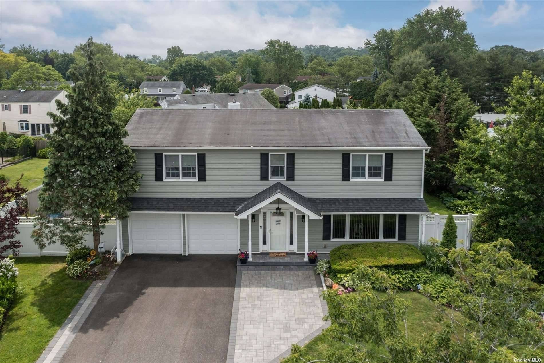 Welcome home to this beautiful splanch located in the Horan Gardens section of Huntington.