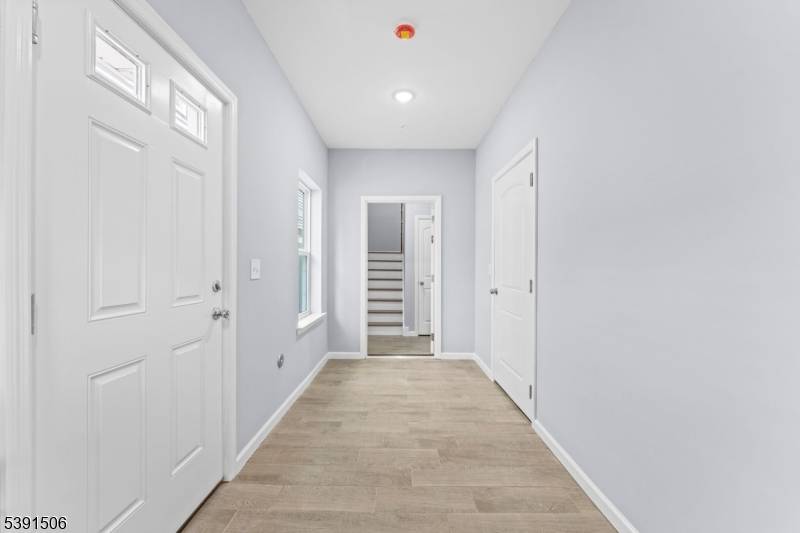Welcome to this New construction 2 family home featuring a total of 7 bedrooms and 5 full bathrooms, including a bonus ground level space with walkout access and full bath.