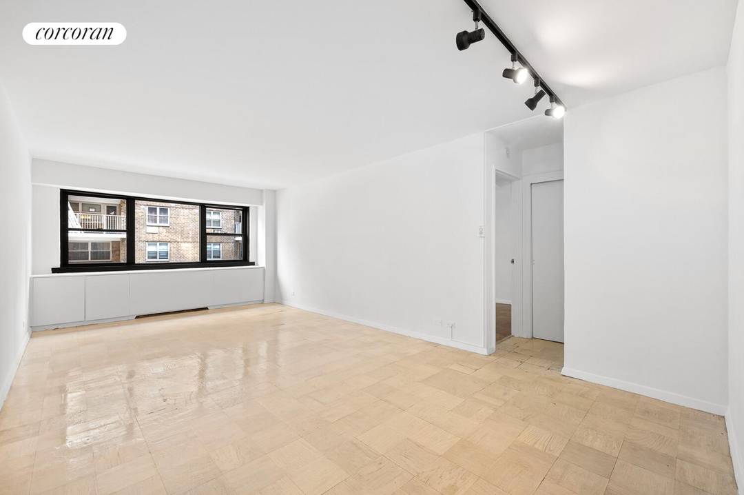 Welcome to this spacious one bedroom residence in a full service Upper East Side cooperative, offering exceptional quiet and comfort.