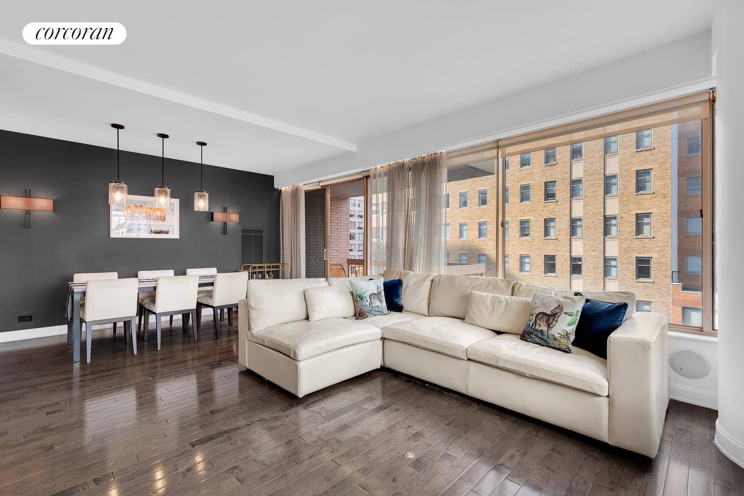 Open city views highlight this two bedroom, two bathroom apartment, framed by floor to ceiling windows.