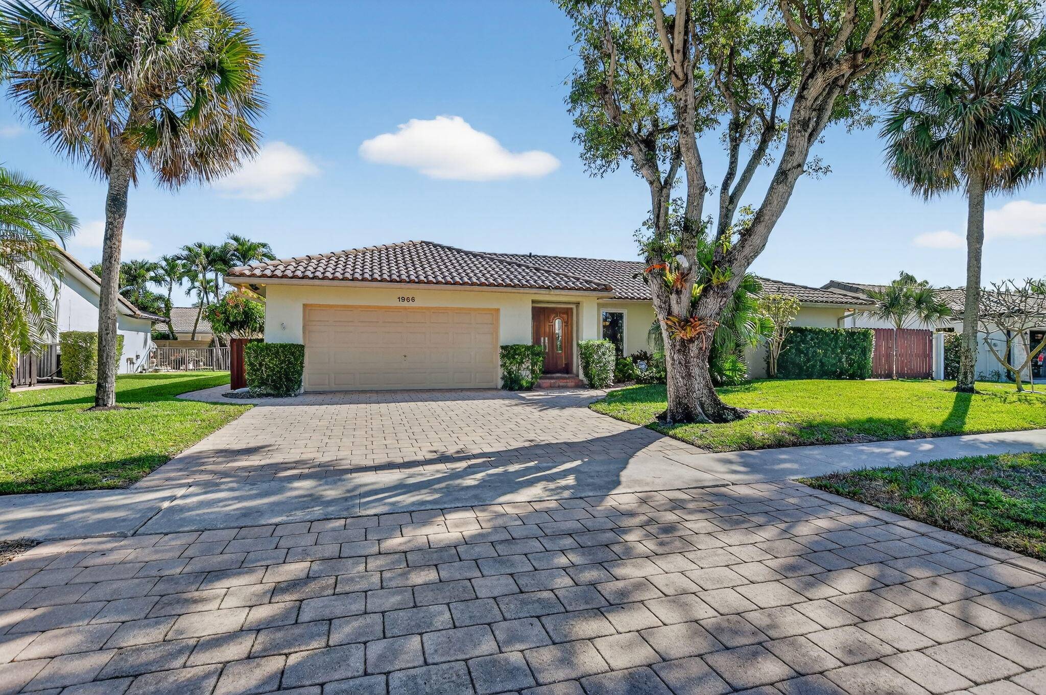 Amazing Opportunity ! Welcome to Camino Lakes in East Boca Raton, where this exquisite Mediterranean style residence blends timeless charm with modern comfort.