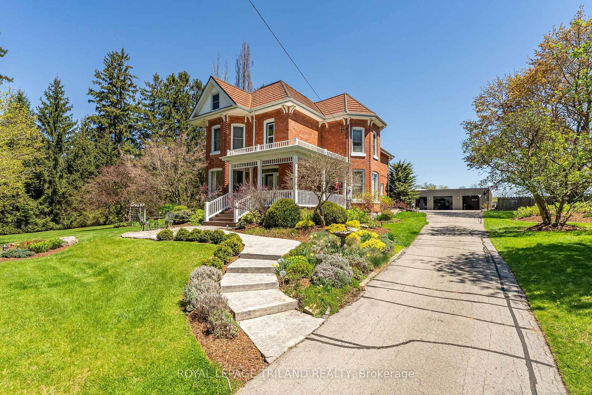 Welcome Home to this Stunning Red Brick Home with 5 bay detached garages, in Union, Ontario !