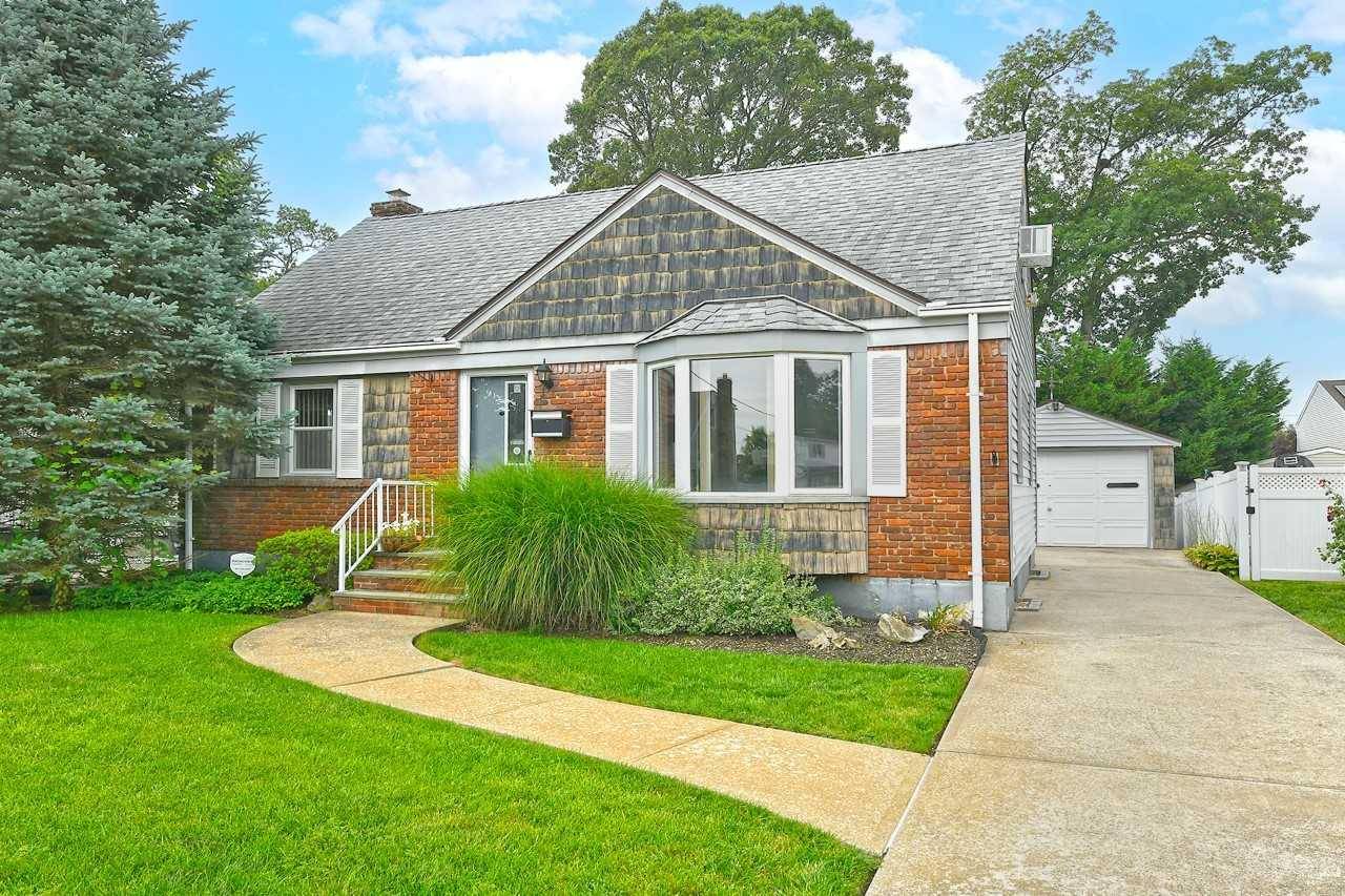 CAPE COD HOME LOCATED ON QUIET BLOCK IN DESIRABLE N.