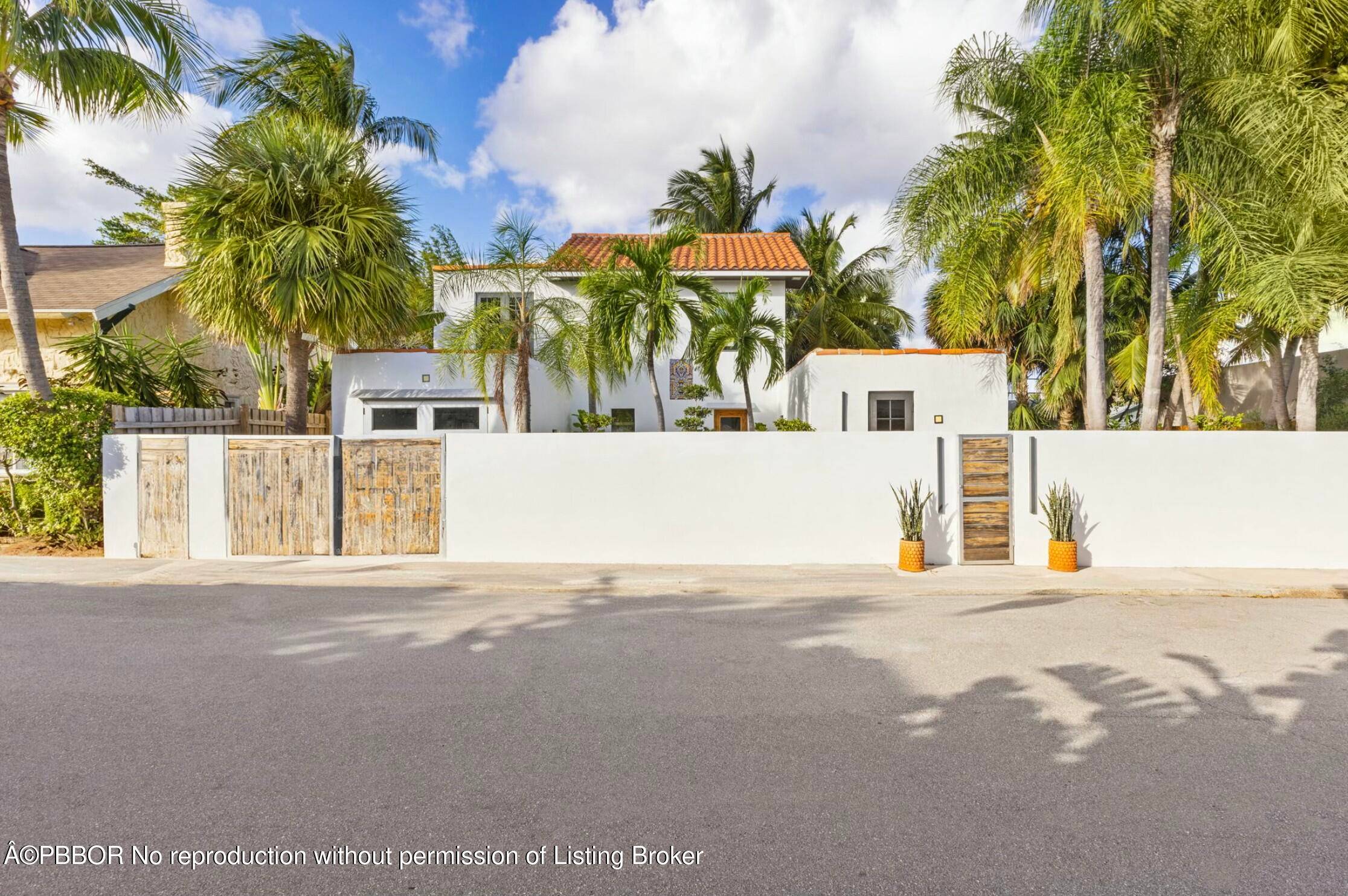 West Palm Beach private compound offers a tropical vibe that meets California contemporary style.