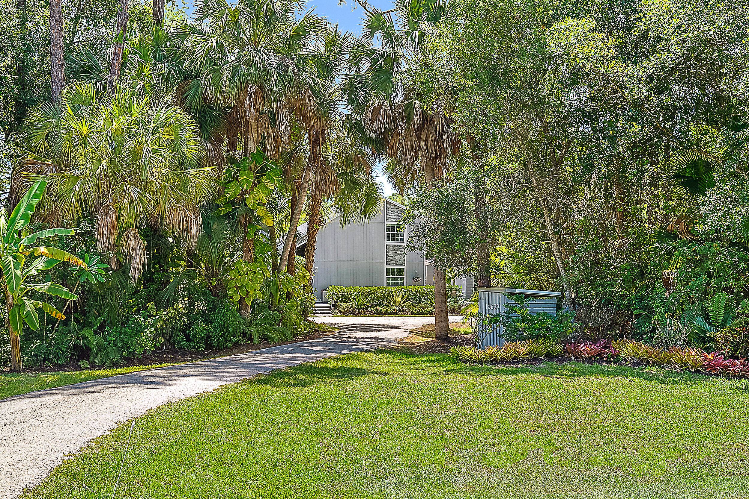 Tucked away on a paved road on the desirable east side of Jupiter Farms, this property offers privacy, space, and flexibility, with a new roof completed in June 2025.