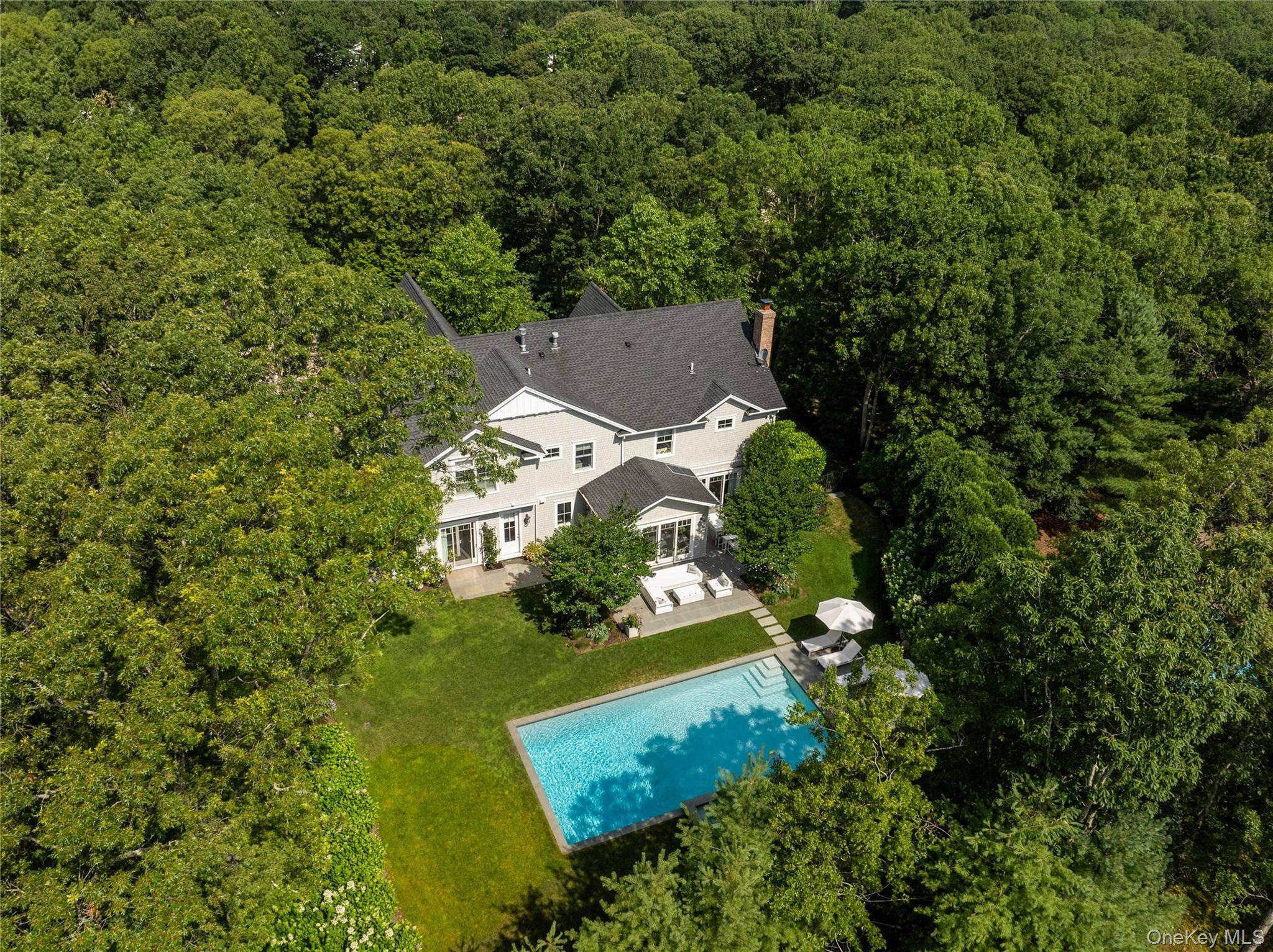 This traditional style Sag Harbor Village residence offers approximately 5, 500 SF across three finished levels on a beautifully landscaped half acre.